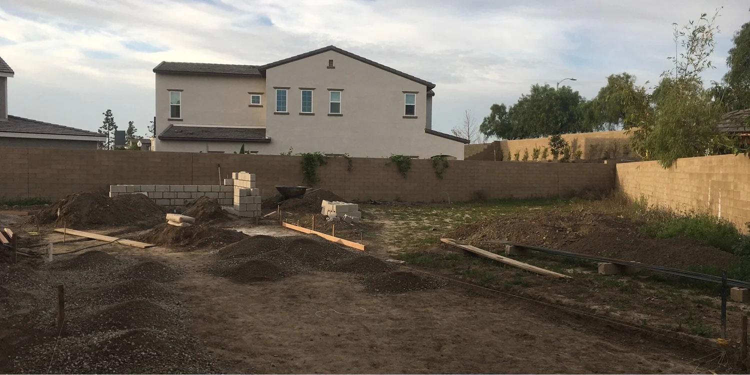 Before: bare graded backyard